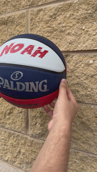 Load and play video in Gallery viewer, Personalised Spalding Rubber Basketball Red/White/Blue TF-150 (Size 5)

